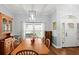 Dining room features a wood table and hardwood floors at 2375 Miles Ct, Lakeland, FL 33812