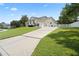 Long driveway leading to a two-car garage and charming home at 2375 Miles Ct, Lakeland, FL 33812