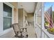 Inviting front porch with rocking chairs and an American flag at 2375 Miles Ct, Lakeland, FL 33812