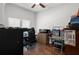 Home office with wood desk and two computer monitors at 2375 Miles Ct, Lakeland, FL 33812