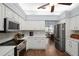 Modern kitchen featuring stainless steel appliances and white cabinetry at 2375 Miles Ct, Lakeland, FL 33812