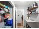 Bright laundry room with storage shelves and cabinets at 2375 Miles Ct, Lakeland, FL 33812