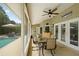 This screened patio boasts a pool view and seating area at 2375 Miles Ct, Lakeland, FL 33812