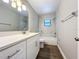 Updated bathroom with marble tile and new vanity at 4201 Shadow Wood Dr, Winter Haven, FL 33880