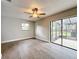 Bedroom with sliding door to patio access at 4201 Shadow Wood Dr, Winter Haven, FL 33880