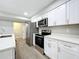 Modern kitchen with stainless steel appliances and white cabinets at 4201 Shadow Wood Dr, Winter Haven, FL 33880