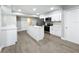 Modern kitchen with stainless steel appliances and white cabinets at 4201 Shadow Wood Dr, Winter Haven, FL 33880