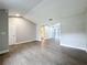 Open concept living room and dining area with vinyl flooring, leading to a pool view at 4201 Shadow Wood Dr, Winter Haven, FL 33880