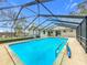 Inviting screened pool with a spacious deck at 4201 Shadow Wood Dr, Winter Haven, FL 33880