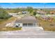 Aerial view of a house and surrounding neighborhood at 503 Se 3Rd St, Mulberry, FL 33860