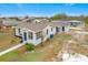 Aerial view showing a renovated single story home with a yard at 503 Se 3Rd St, Mulberry, FL 33860