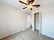 Bedroom with ceiling fan, closet and window at 503 Se 3Rd St, Mulberry, FL 33860