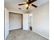 Cozy bedroom with ceiling fan and large closet at 503 Se 3Rd St, Mulberry, FL 33860