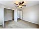 Spacious bedroom with ceiling fan and walk-in closet at 503 Se 3Rd St, Mulberry, FL 33860