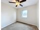 Well-lit bedroom with ceiling fan and window at 503 Se 3Rd St, Mulberry, FL 33860