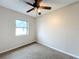 Bright bedroom with ceiling fan and window at 503 Se 3Rd St, Mulberry, FL 33860