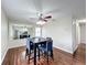 Dining area with hardwood floors and a large mirror at 503 Se 3Rd St, Mulberry, FL 33860