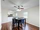 Dining room with hardwood floors and a ceiling fan at 503 Se 3Rd St, Mulberry, FL 33860