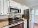 Stainless steel appliances and granite countertops in a renovated kitchen at 503 Se 3Rd St, Mulberry, FL 33860