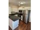 Renovated kitchen with stainless steel appliances and dark countertops at 503 Se 3Rd St, Mulberry, FL 33860