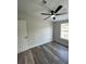 Well-lit bedroom with ceiling fan and vinyl flooring at 7612 Glen Meadow Dr, Lakeland, FL 33810