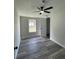 Bright bedroom with ceiling fan and vinyl flooring at 7612 Glen Meadow Dr, Lakeland, FL 33810