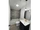 Bathroom with a stylish vanity, tiled shower, and modern fixtures, offering a comfortable and updated space at 9619 Moore Rd, Lakeland, FL 33809