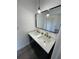 Bathroom with double vanity and stylish light fixtures at 9619 Moore Rd, Lakeland, FL 33809