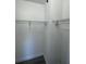 Large closet with double hanging rods and wood-look flooring at 9619 Moore Rd, Lakeland, FL 33809