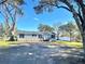 Mobile home with a spacious yard and mature trees at 9619 Moore Rd, Lakeland, FL 33809