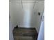 Laundry closet with wire shelving and wood-look flooring at 9619 Moore Rd, Lakeland, FL 33809