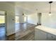 Spacious living room with wood-look flooring and a ceiling fan at 9619 Moore Rd, Lakeland, FL 33809