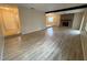 Open living area with wood flooring and brick fireplace at 1024 Driggers Rd, Lakeland, FL 33809