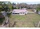 Aerial shot of the home showing its roof, yard, and surrounding neighborhood at 1025 E Georgia St, Bartow, FL 33830