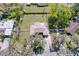 Overhead view of the property showcasing the layout, backyard, and landscaping at 1025 E Georgia St, Bartow, FL 33830