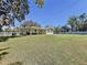 Spacious backyard featuring a patio and well-maintained lawn and fencing at 1025 E Georgia St, Bartow, FL 33830