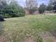 Backyard with grassy area and playground equipment at 121 7Th Terrace Wahneta Way, Winter Haven, FL 33880