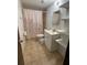 Clean bathroom with a shower/tub combo, toilet and vanity at 121 7Th Terrace Wahneta Way, Winter Haven, FL 33880