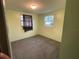 Bedroom with light green walls and carpet at 121 7Th Terrace Wahneta Way, Winter Haven, FL 33880