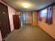 Bedroom with pink walls and wood closet at 121 7Th Terrace Wahneta Way, Winter Haven, FL 33880