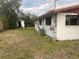 Backyard view of a single story house with shed at 121 7Th Terrace Wahneta Way, Winter Haven, FL 33880