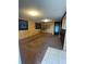 Living room with wood paneling and brown carpet at 121 7Th Terrace Wahneta Way, Winter Haven, FL 33880