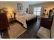 Bedroom features wood-look flooring, ceiling fan and a shuttered window at 121 Belmont Dr, Winter Haven, FL 33884