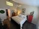 Bedroom featuring a patterned duvet, ceiling fan, and natural light at 121 Belmont Dr, Winter Haven, FL 33884