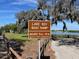 Sign for Lake Roy Boat Ramp, showing hours of operation from 5AM to 10PM at 121 Belmont Dr, Winter Haven, FL 33884