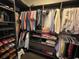 Organized walk-in closet featuring shelving, hanging rods, and neatly arranged clothing and accessories at 121 Belmont Dr, Winter Haven, FL 33884