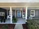 Inviting front porch with lots of seating at 121 Belmont Dr, Winter Haven, FL 33884