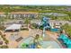 Aerial view of community pool, water park, and homes at 187 Brooke'S Pl, Haines City, FL 33844