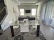 Casual dining area with glass-top table and white chairs at 187 Brooke'S Pl, Haines City, FL 33844