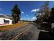 Street view of a peaceful neighborhood with beautiful landscaping and clear blue skies at 2055 S Floral Ave # 73, Bartow, FL 33830